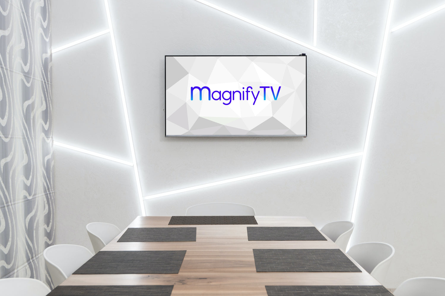 MagnifyTV logo on a TV on a white light wall