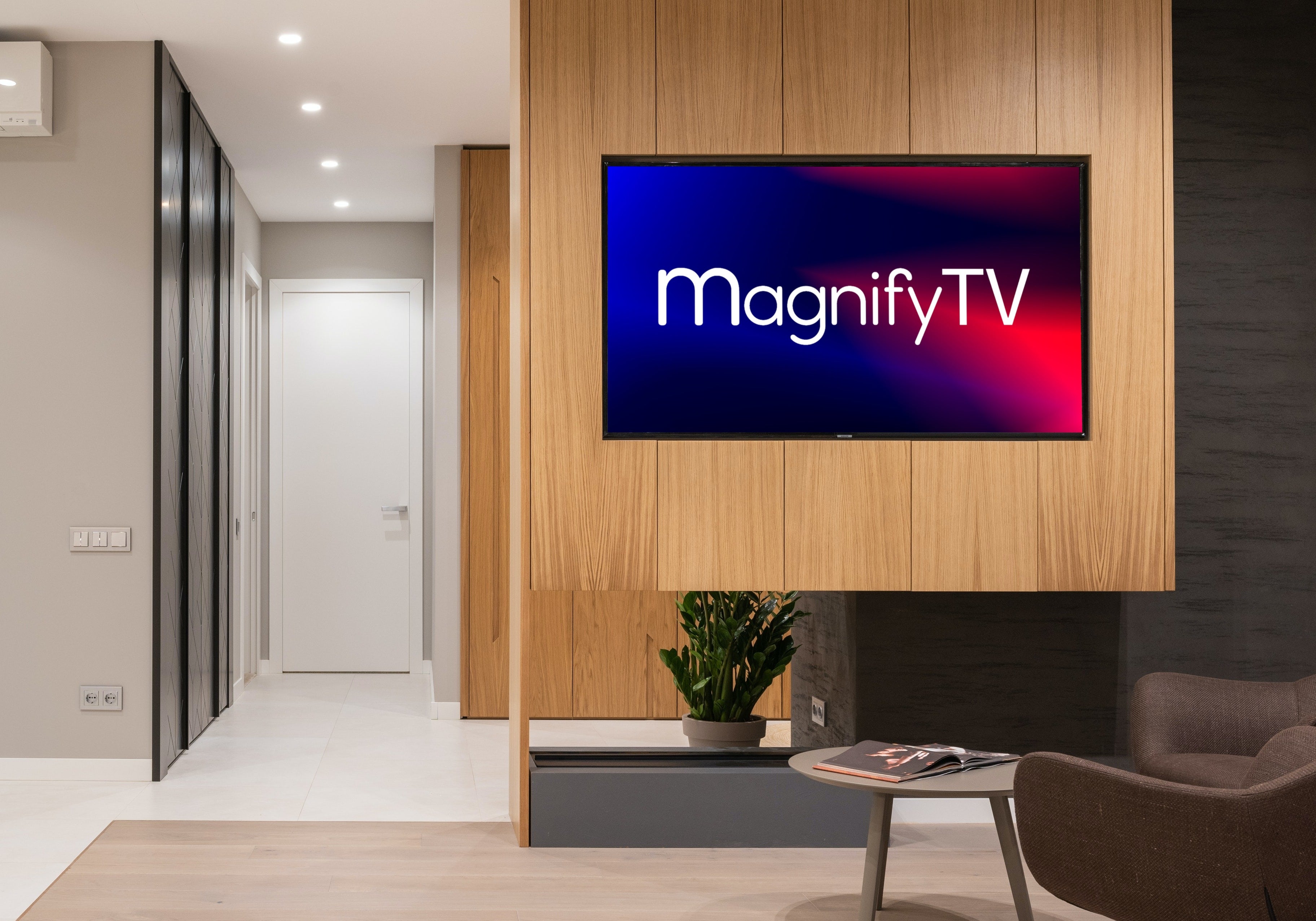 Lobby TV on wall with MagnifyTV logo